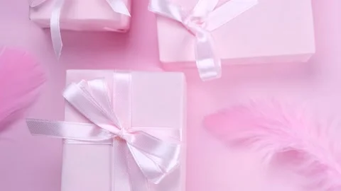 Rotating background with pink gift boxes with pink bows on a pink background Stock Footage 211422434