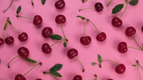 Rotating background of ripe wet cherries with water drops on a black background Stock Footage 200187523