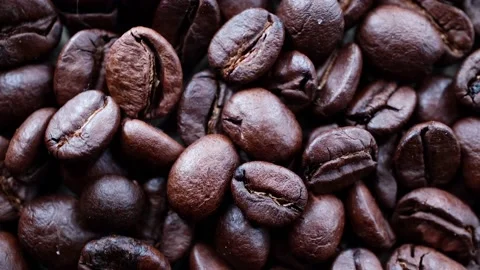 Rotating background from roasted coffee beans Video stock 232728172