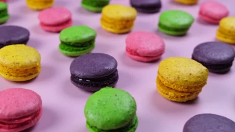 Rotating background of sweet macaroon cookies in different colors Stock Footage 225864025
