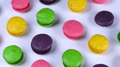 Rotating background of sweet macaroon cookies in different colors Stock Footage 231301239