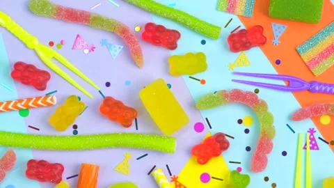Rotating background of various jelly sweets, bears, donuts, candies, sprinkles Stock Footage 245815582