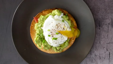 Rotating Bagel with Avocado and Egg Stock Footage 146590870