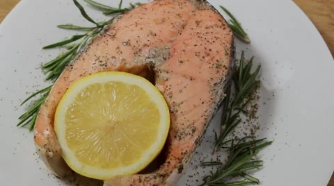 Rotating baked salmon steak Stock Footage 64830628