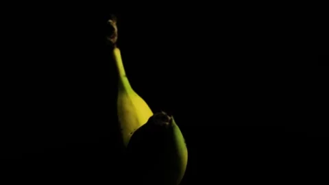 Rotating Banana on Dark Background Close Up Stock Footage 329966118