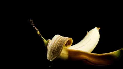 Rotating Banana on Dark Background Close Up Stock Footage 329966278