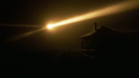 Rotating beam of Light house lantern illuminating thick fog cloud by yellow beam Video stock 168147603