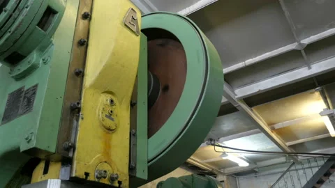 Rotating a big flywheel in a workshop at a plant. Stock Footage 87783650