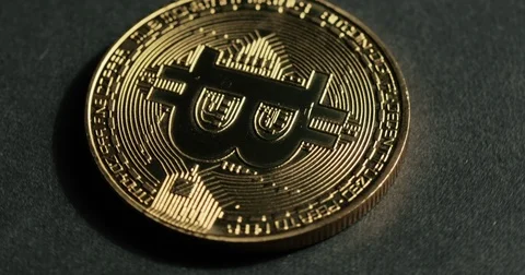 Rotating Bitcoin on a black background Video stock 79034991