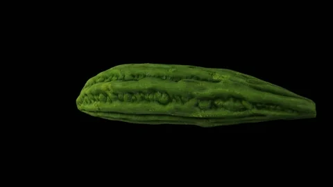 Rotating Bitter Melon on Black Background (Looping) Stock Footage 146674556
