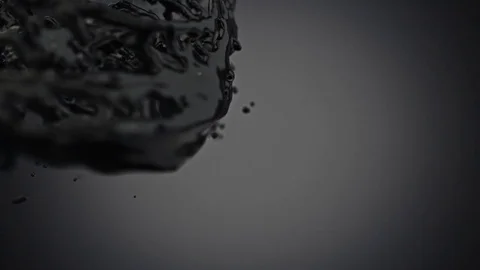 Rotating Black Text Covered in Oil Stock Footage 72662903