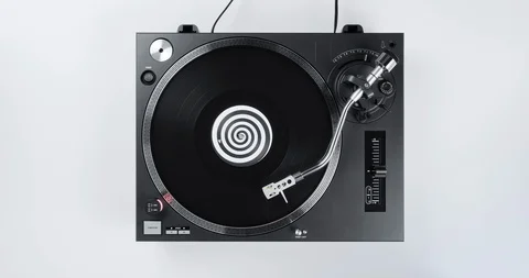 Rotating black vinyl record turntable top view musical DJ record player Stock Footage 126409798