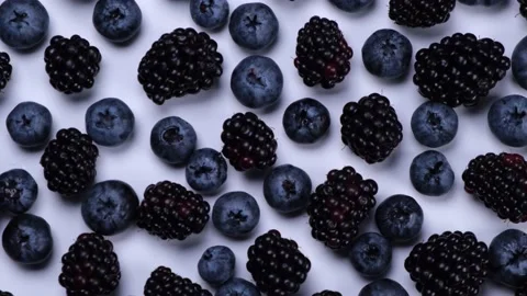 Rotating blackberry berries on white background top view Stock Footage 221019387