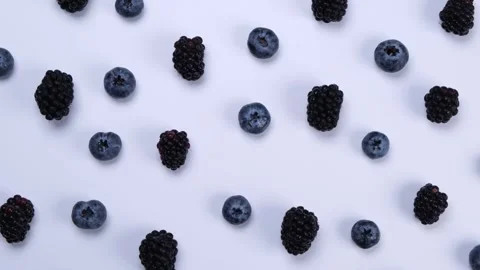 Rotating blackberry berries on white background top view Stock Footage 245972675