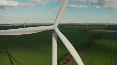Rotating blade of windmachine on green field in summer Video stock 155611195