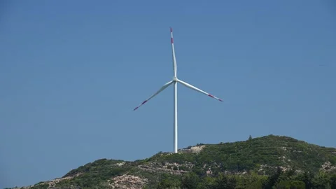 Rotating blades of windmill against blue sky 스톡 동영상 255298110