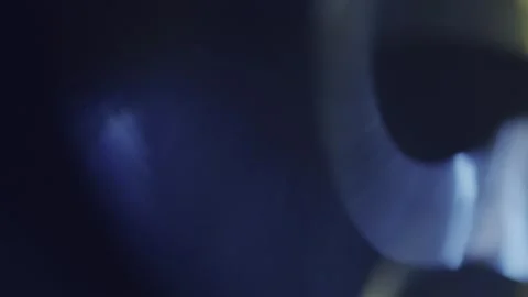 Rotating blue and yellow particles on a dark background Stock Footage 252379055