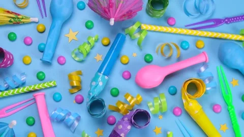 Rotating blue background with candies, balloons and tubes for birthday or party Stock Footage 198213961