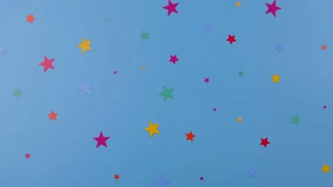 Rotating blue background with multicolored stars, concept for celebrating a boy Stock Footage 194816398