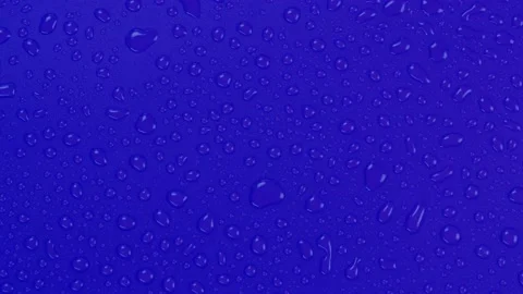 Rotating blue background with water drops top view Stock Footage 197434309