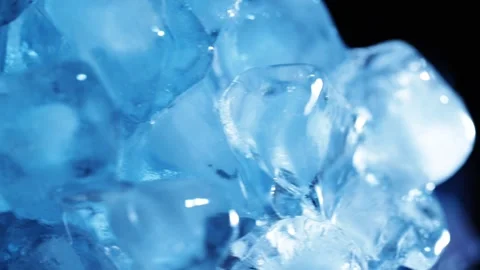 Rotating blue ice cubes for cooling drink visuals, refreshment concepts and.. Stock Footage 345089883