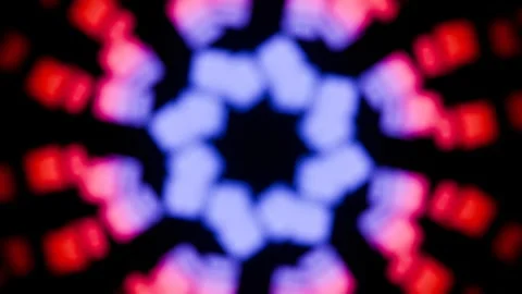 Rotating blurry colored shapes on a black background in a seamless loop. Video stock 291976143