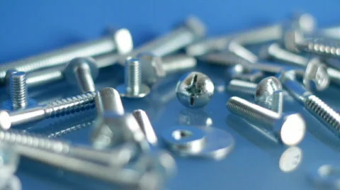 Rotating bolts and nuts on workbench. Stock Footage 582705