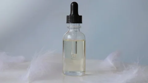 Rotating bottle with pipette and Essential liquid Medical and cosmetic concept. Stock Footage 112551939