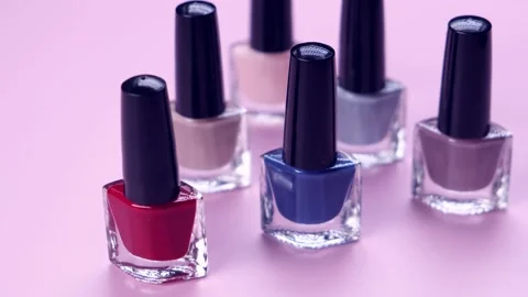 Rotating bottles or jars nail polish a coating for manicure or nail polish Stock Footage 220606916
