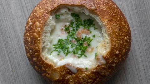 Rotating Bowl of Clam Chowder in a Bread Bowl Stock Footage 187640828