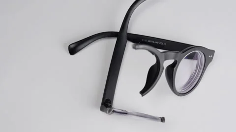 Rotating Broken Black Diopter Glasses. Stock Footage 130758212