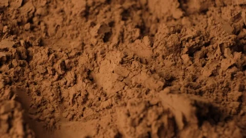 Rotating brown cocoa powder background for culinary video projects. Stock Footage 334872336
