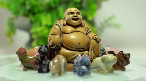 Rotating Buddha surrounded 12 stone animals Video stock 46292628