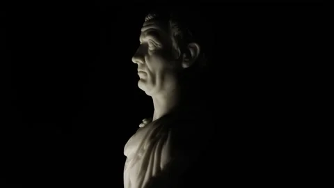Rotating bust of Julius Caesar lit from below Video stock 145475812
