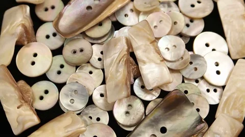 Rotating buttons made of pearl Stock Footage 83853305