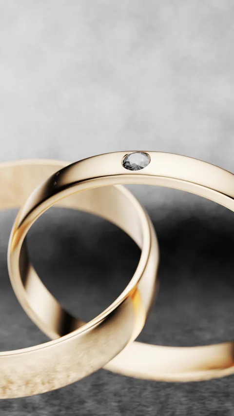 Rotating the camera around two gold rings. Stock Footage 250149159