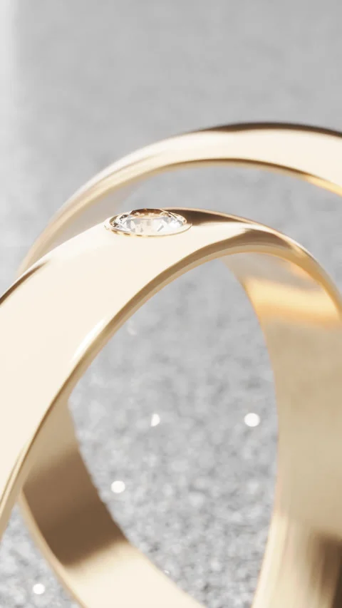 Rotating the camera around two gold rings. Stock Footage 250198355