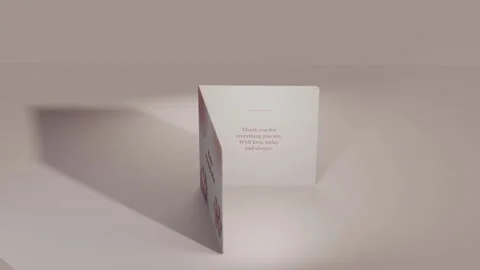 Rotating camera causing folded card opening at studio set to reveal Mother's Day Vídeos de archivo 339721887