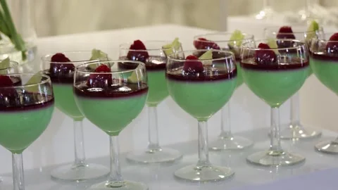 Rotating Camera Shot of Elegant Mint Cream Desserts in Glasses at Luxury Event Stock Footage 327357582
