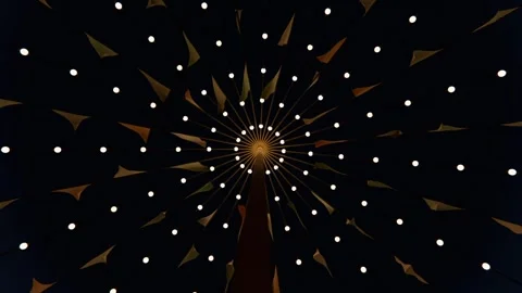 Rotating canopy shifting fabric flags at night as camera recording motion, with Stock Footage 339722067