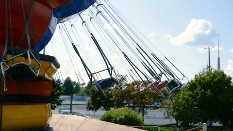 Rotating carousel in an amusement park on a summer day Stock Footage 113325480