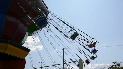 Rotating carousel in an amusement park on a summer day Stock Footage 113325484