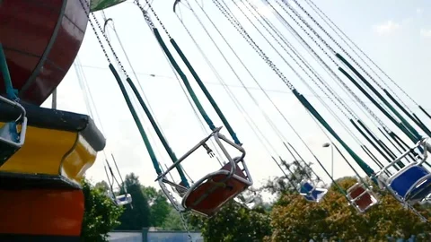 Rotating carousel in an amusement park on a summer day Stock Footage 113325511