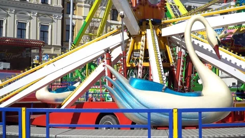 The rotating carousel in the form of swans. Stock Footage 88657060