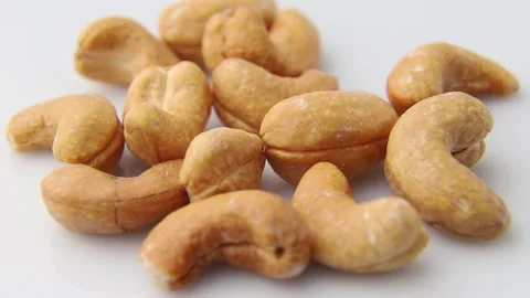 Rotating of cashew on white background. Side view. Stock Footage 136050463