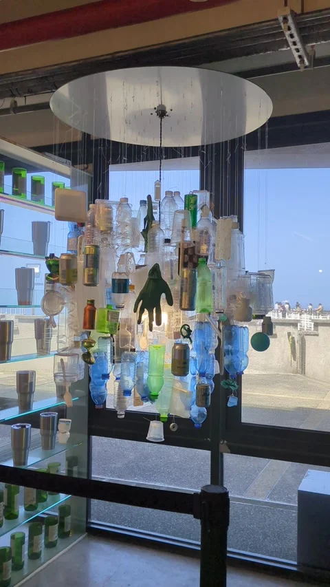 Rotating Ceiling hanging decor with Plastic bottles and containers Stock Footage 313485903