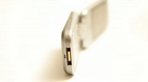 Rotating cellular phone on white Stock Footage 526461