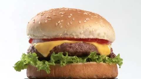A rotating cheeseburger Stock Footage 8570819
