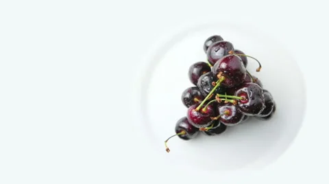 Rotating Cherries on White Background Aerial Shot Video stock 62026248