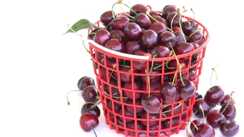 Rotating of cherry in a red plastic basket Stock Footage 76983594